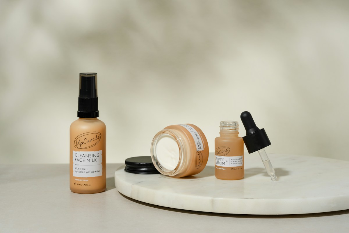 Skincare products on a marble surface, illustrative stock photograph