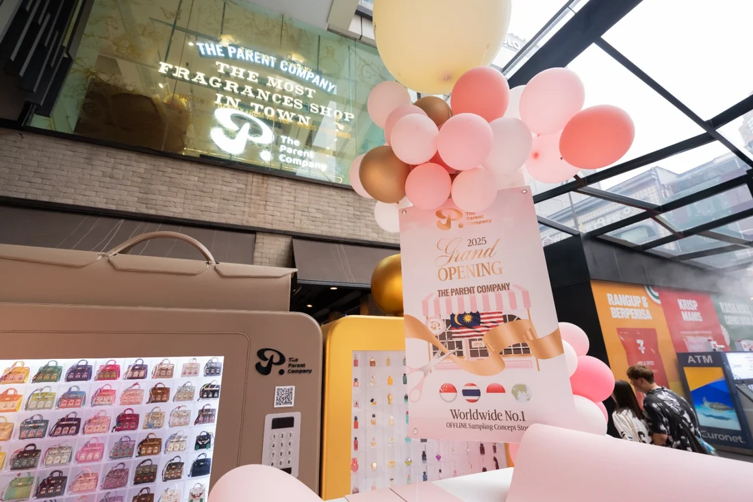 The Parent Company storefront with balloons and a grand opening display
